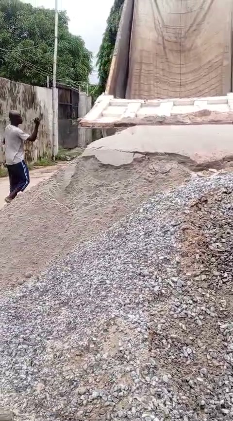 Worker receiving construction materials on site
